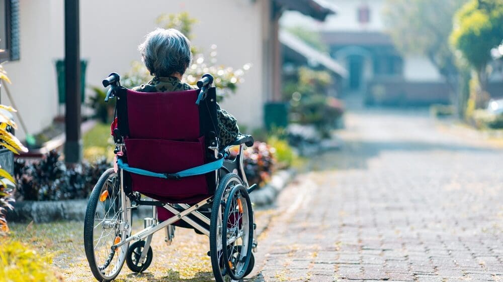 A senior woman on a wheelchair